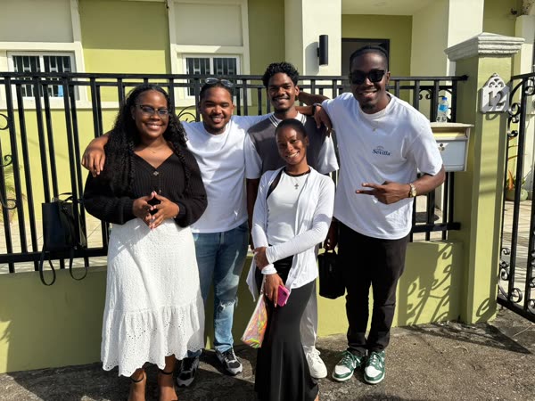Champion members smiling together at the church gate